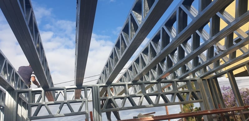 Crew erecting wall frames on site